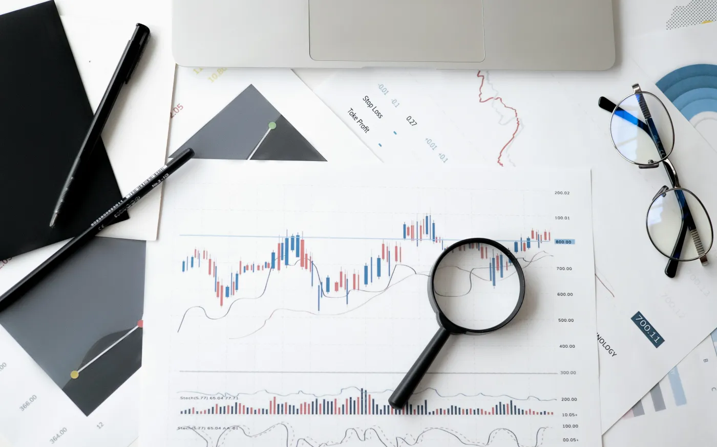 magnifying glass on top of a financial chart